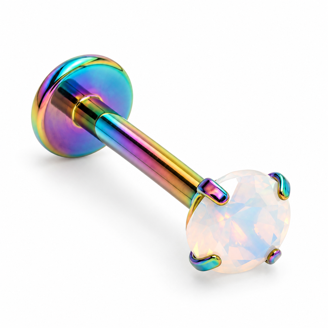 Rainbow multicoloured titanium flat back labret stud featuring a round white opal gemstone in a four-prong setting.
