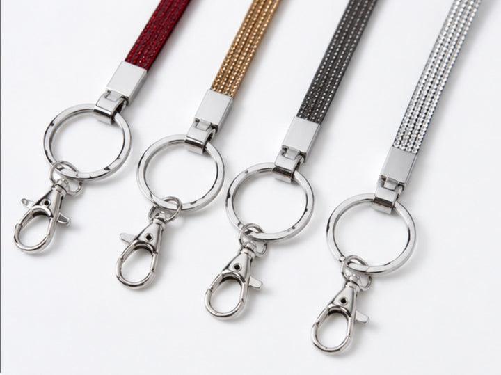 Crystal sparkle lanyards in red, gold, grey and silver with silver-tone keyring and clasp attachments.