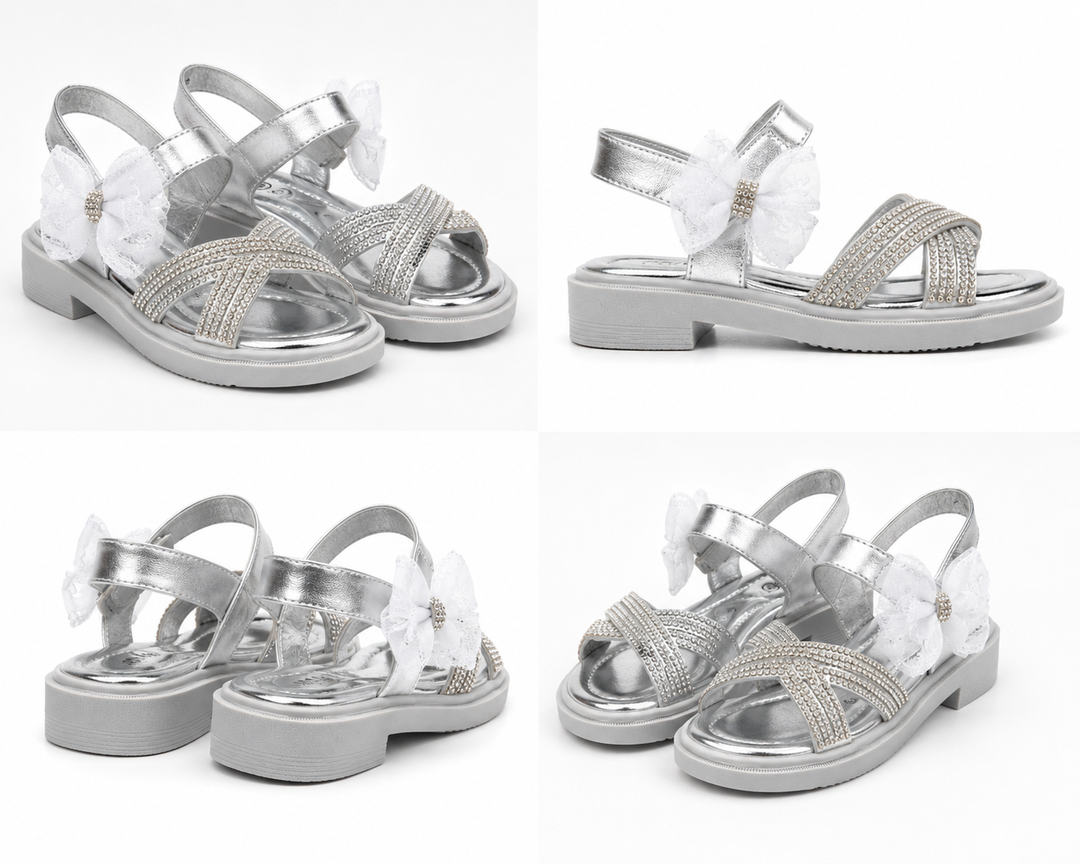 Silver girls’ sandals with sparkling diamanté crossover straps, oversized glitter mesh bow detail 