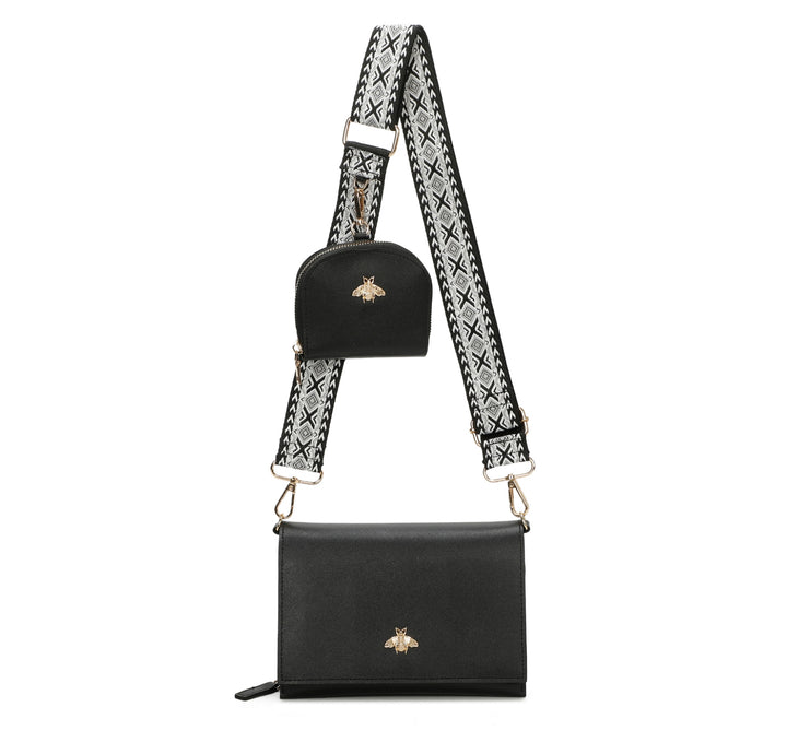 Black handbag with decorative strap on a white background