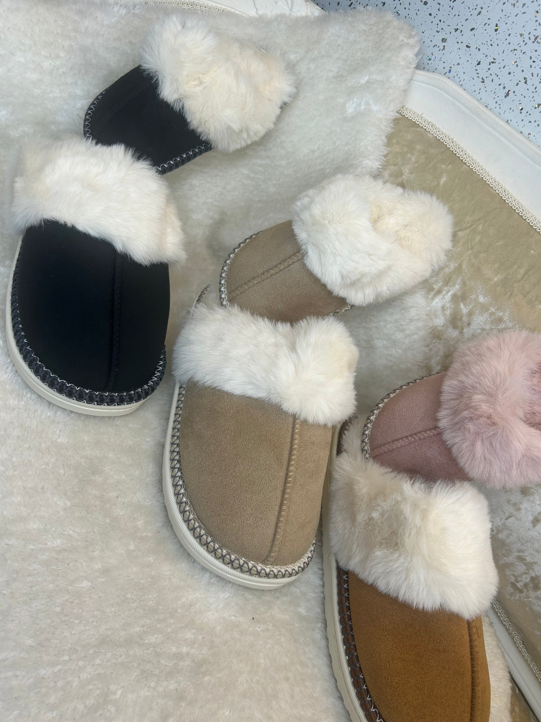 Cosy faux-fur lined slippers with a hard sole 