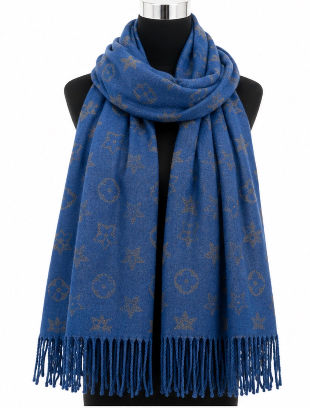 Blue reversible woven scarf with metallic-effect star and circular print, contrasting reverse and fringed edges.