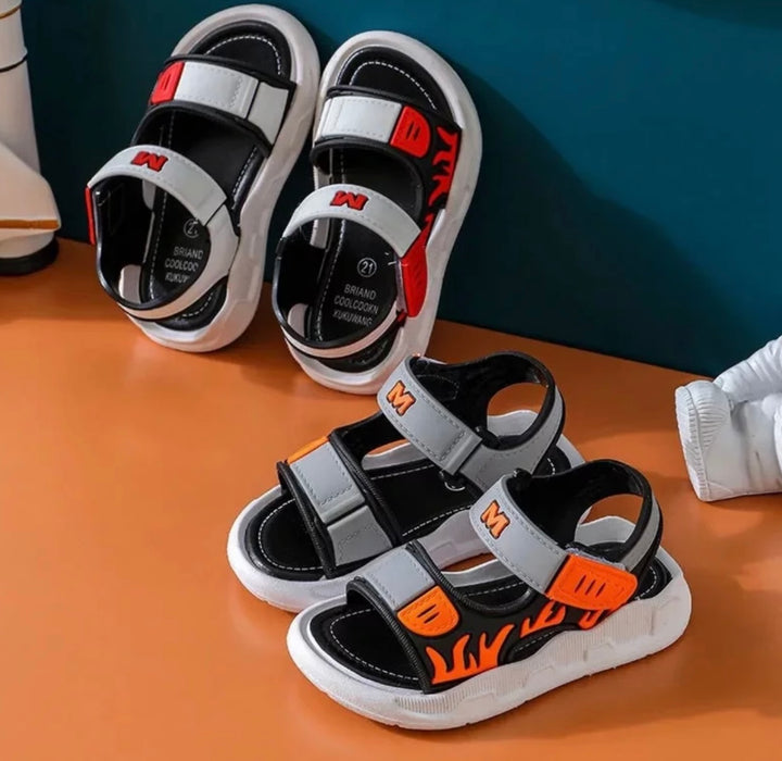 a collection of boys sandals in different available colours red and orange 