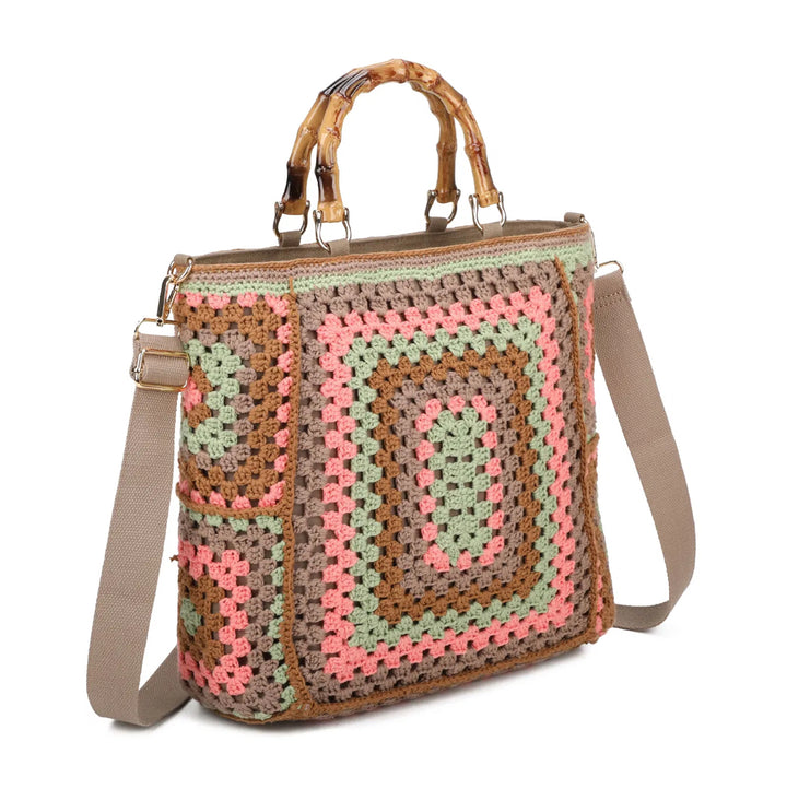 Beige based crochet grab bags with bamboo handles and a top zip closure