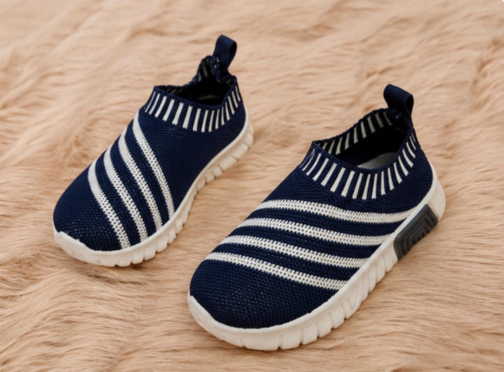 slip-on trainers in navy and white design with lightweight flexible soles.