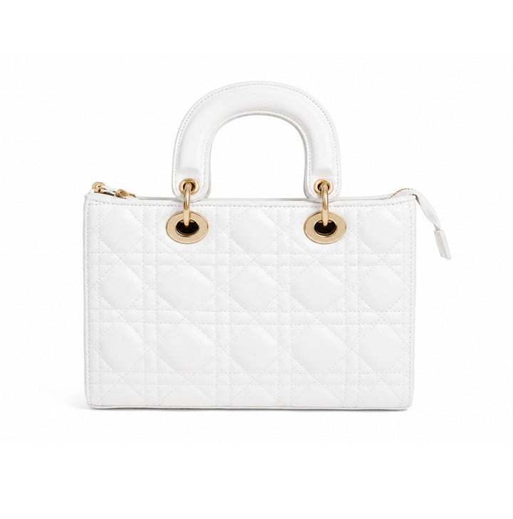 A white quilted leather top-handle handbag with gold-tone hardware, shown against a plain white background.