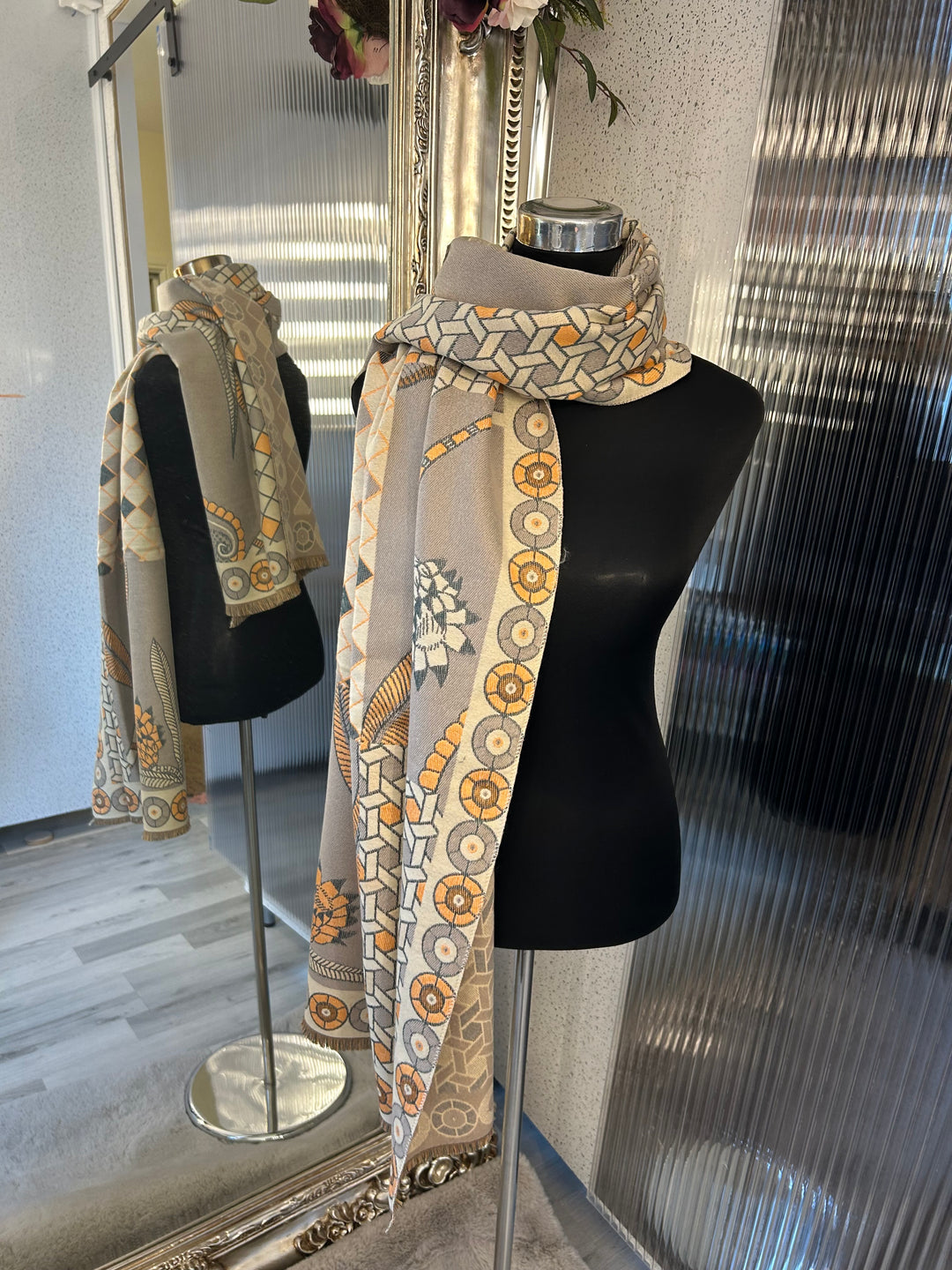 Beige geometric scarf with grey and orange accent 