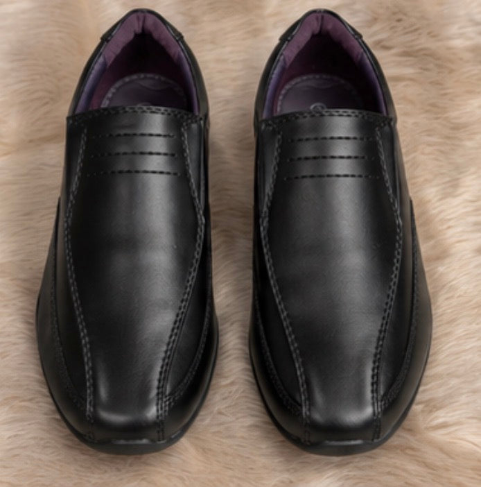 Boys black smart shoes with smooth leather-look finish and comfortable low wedge sole.