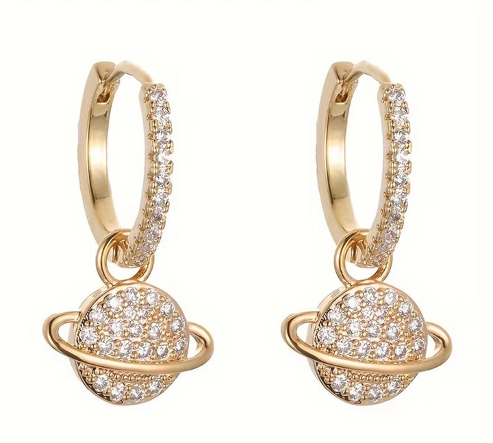 Sparkling crystal planet drop hoop earrings available in gold and silver.