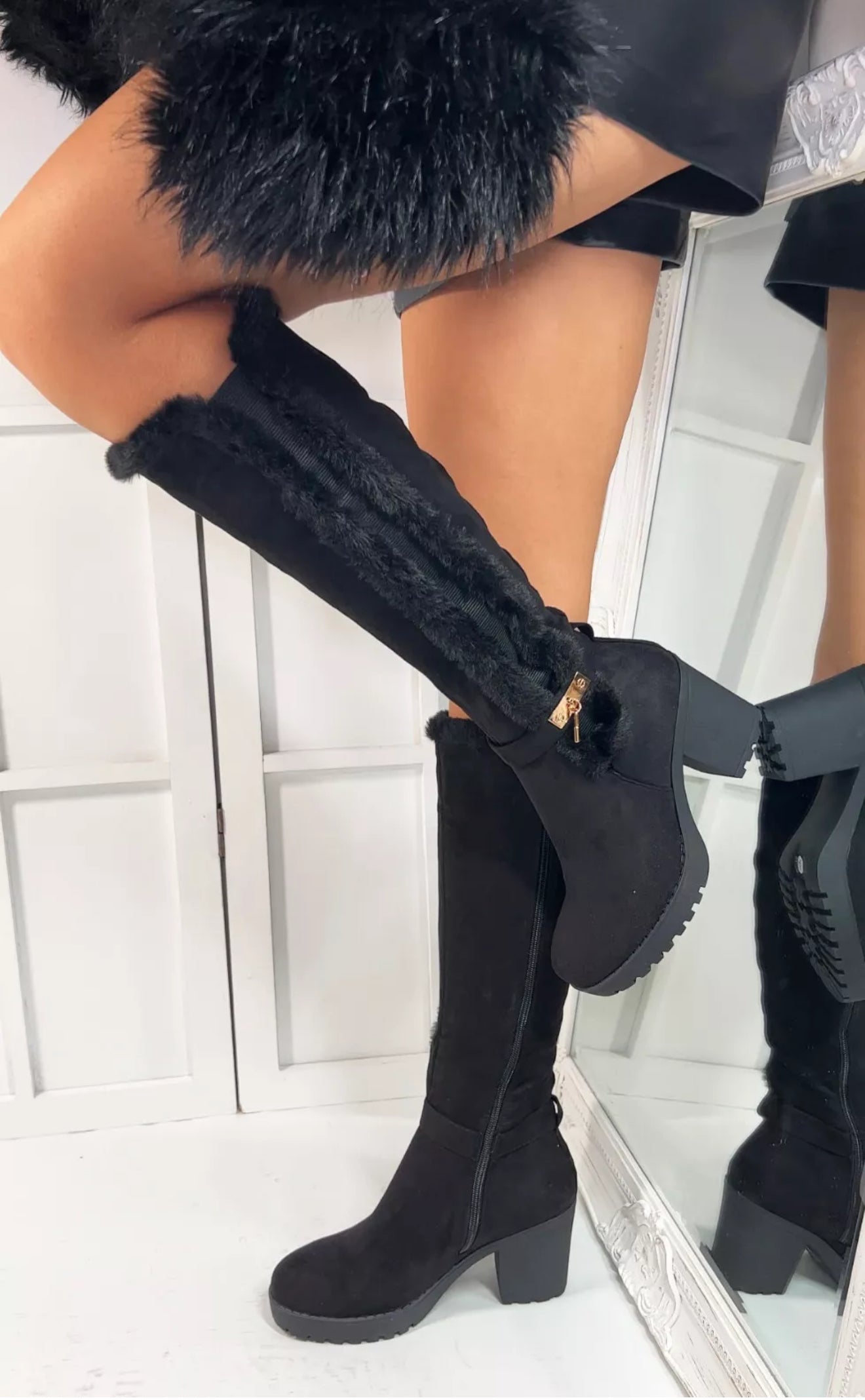 Black fur lined heel knee high boots