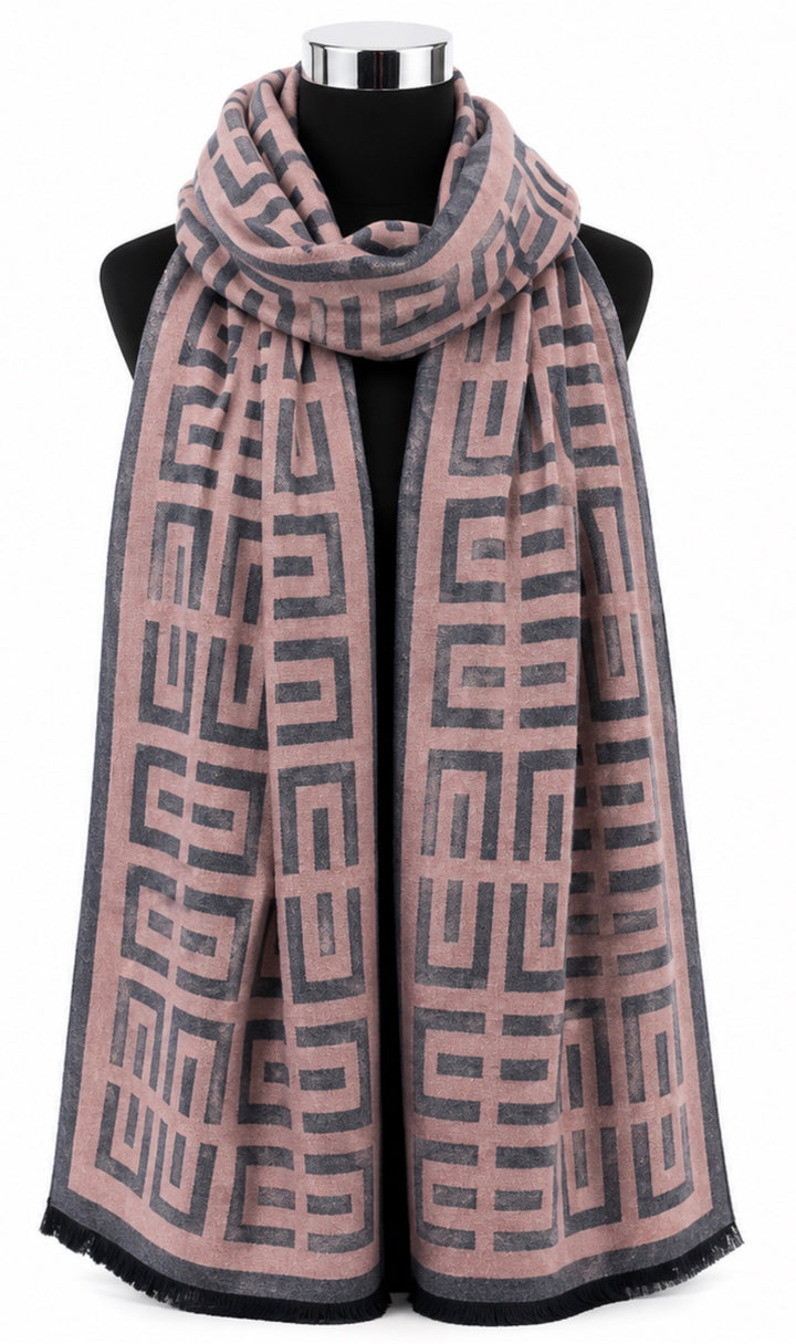 Blush pink and charcoal grey geometric maze print woven scarf with dark border and short fringed edging.