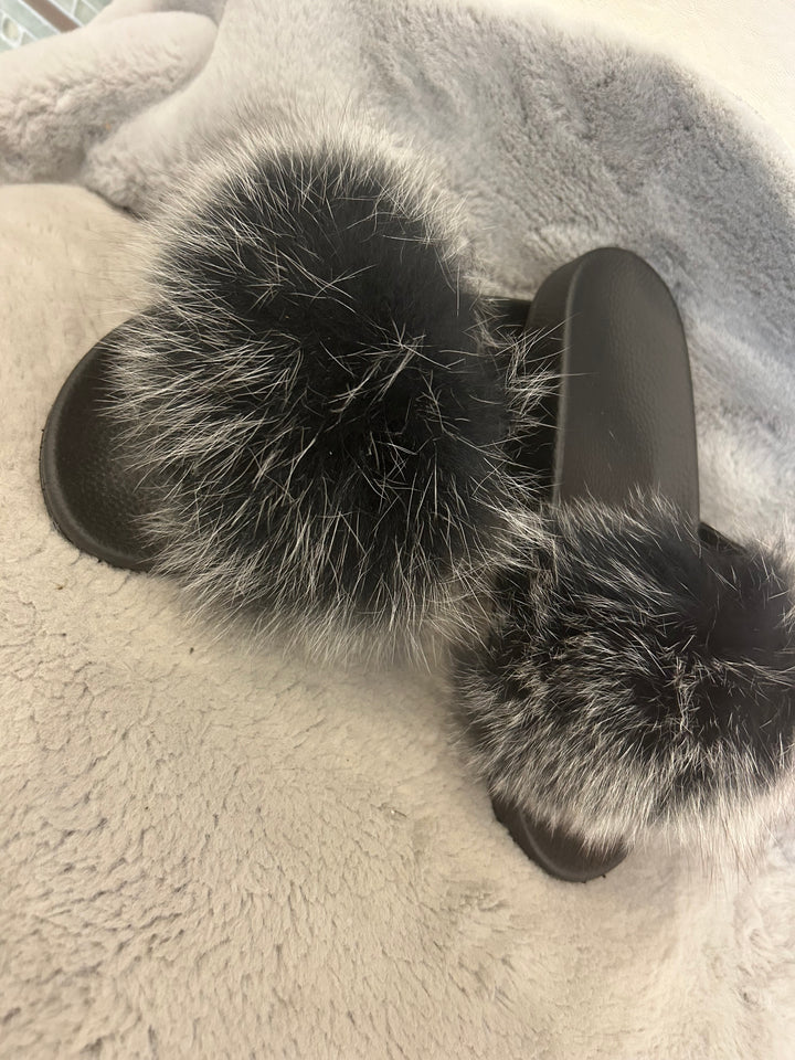 Grey fur sliders with black sole 