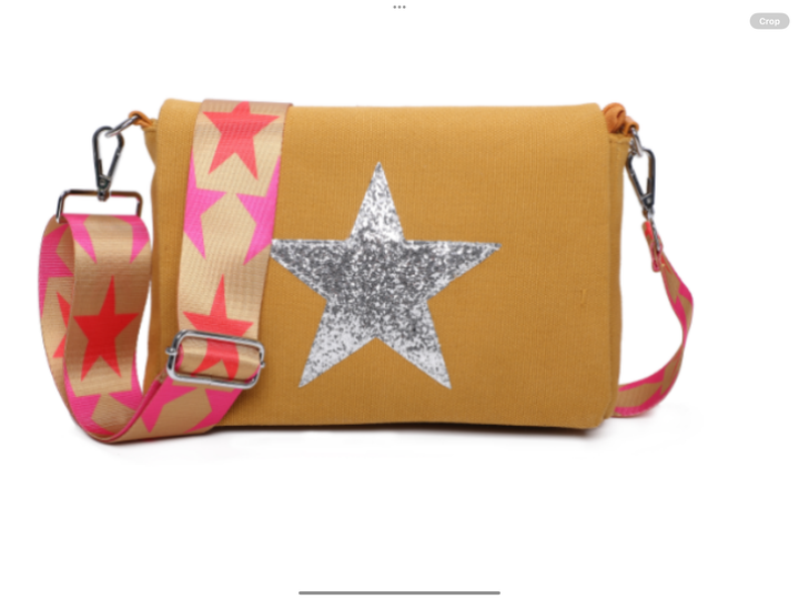 Yellow bag with a star design and pink strap 
