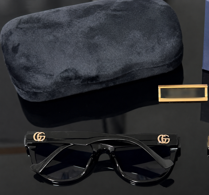 Simple black unisex sunglasses with gold detail 