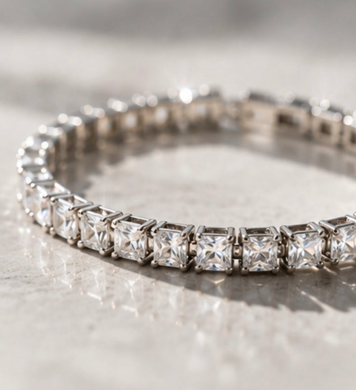 Silver tennis bracelet featuring sparkling square-cut cubic zirconia stones