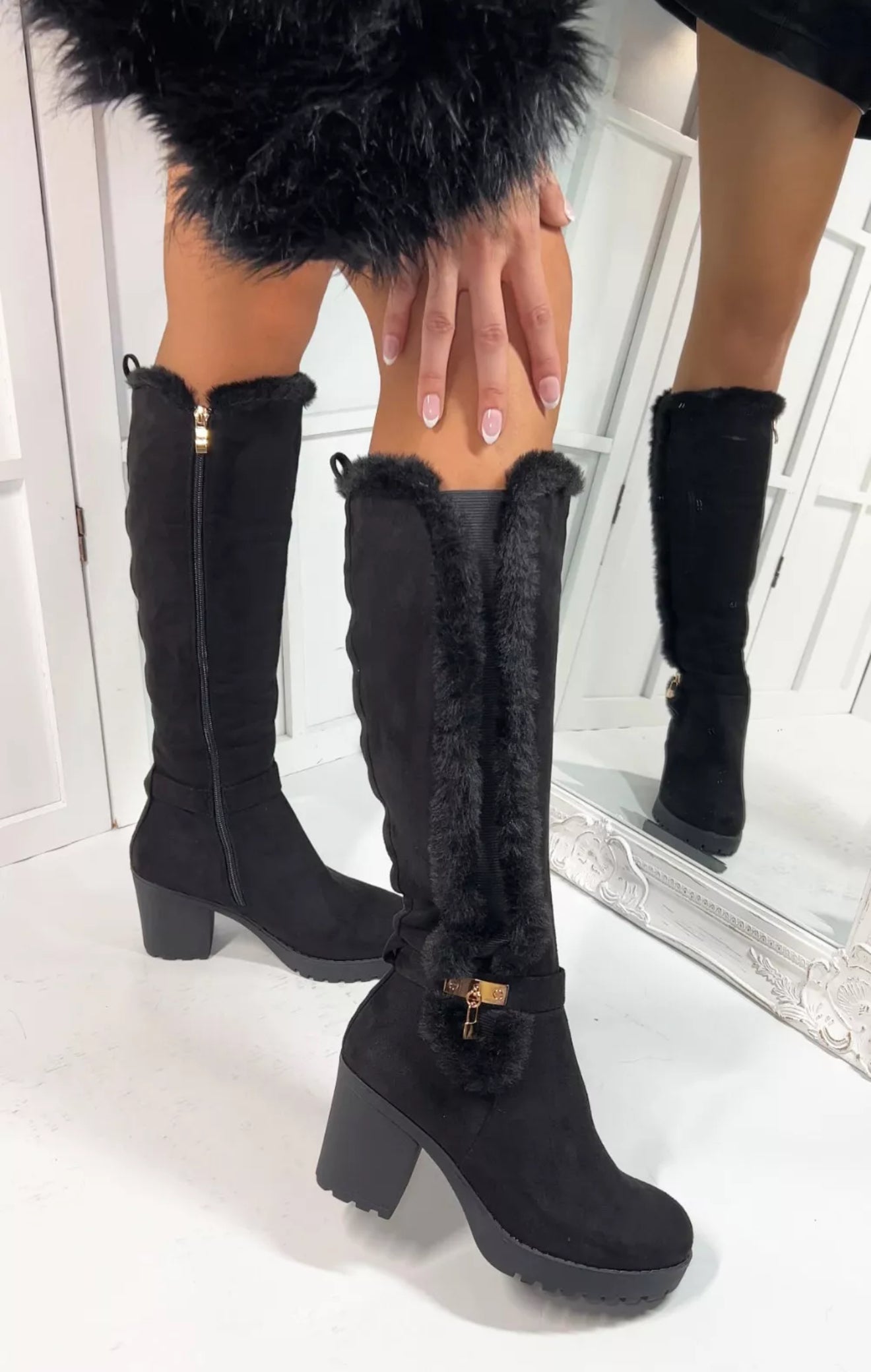 Black fur lined heel knee high boots