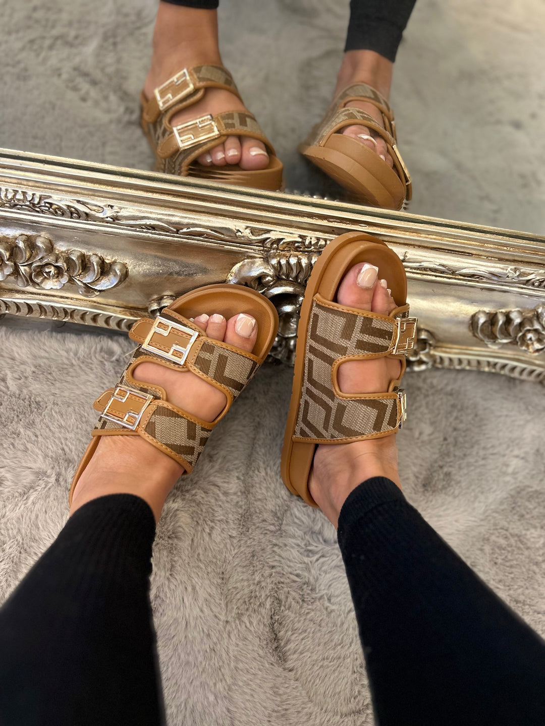 Tan patterned sliders with gold buckle detail