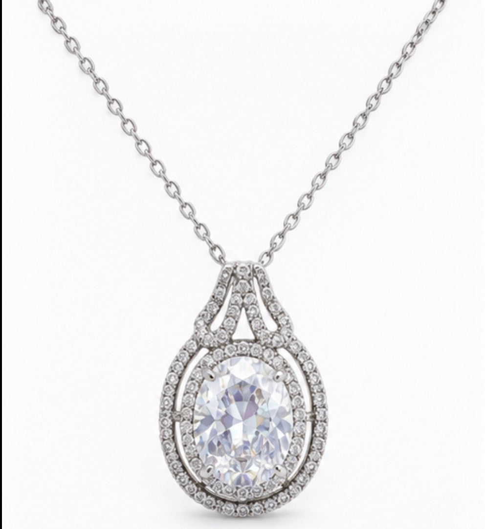 Silver teardrop crystal pendant necklace with halo detailing and adjustable chain 