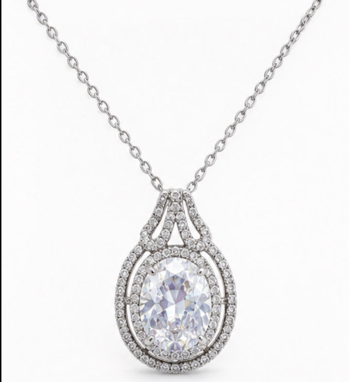 Silver teardrop crystal pendant necklace with halo detailing and adjustable chain 