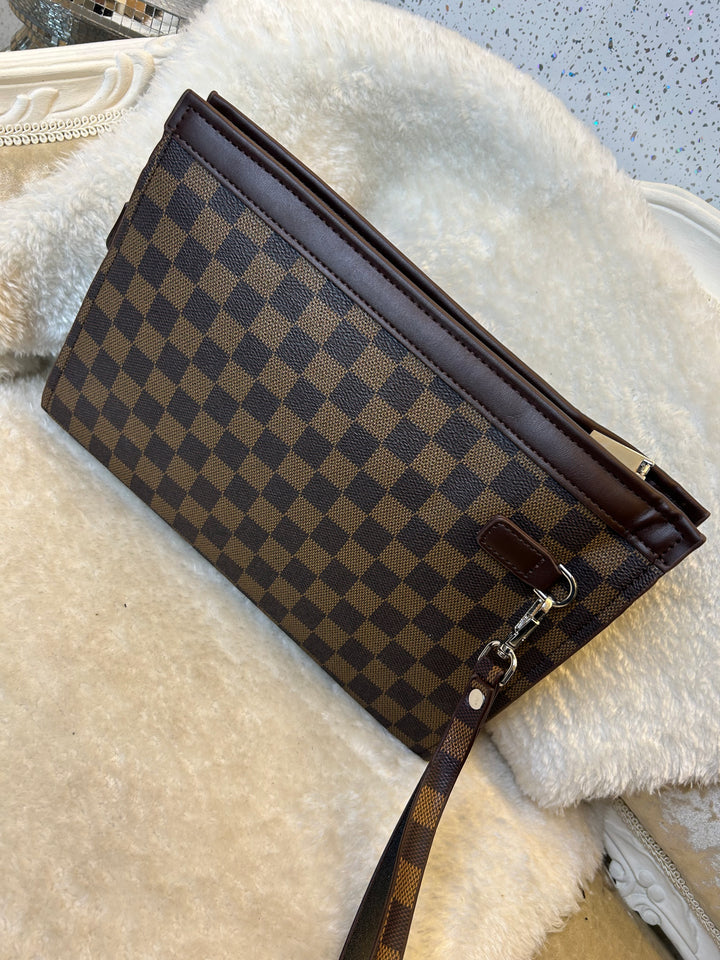 Checkered wallet clutch bag with a brown and black pattern 