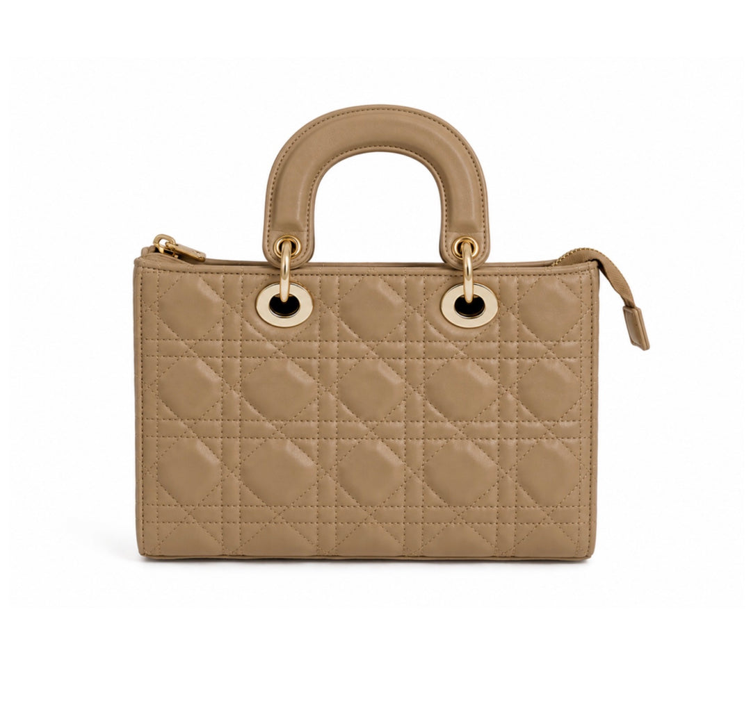 A structured quilted handbag in taupe leather with gold-tone hardware, featuring a top handle and zip-around closure, shown against a plain white background.
