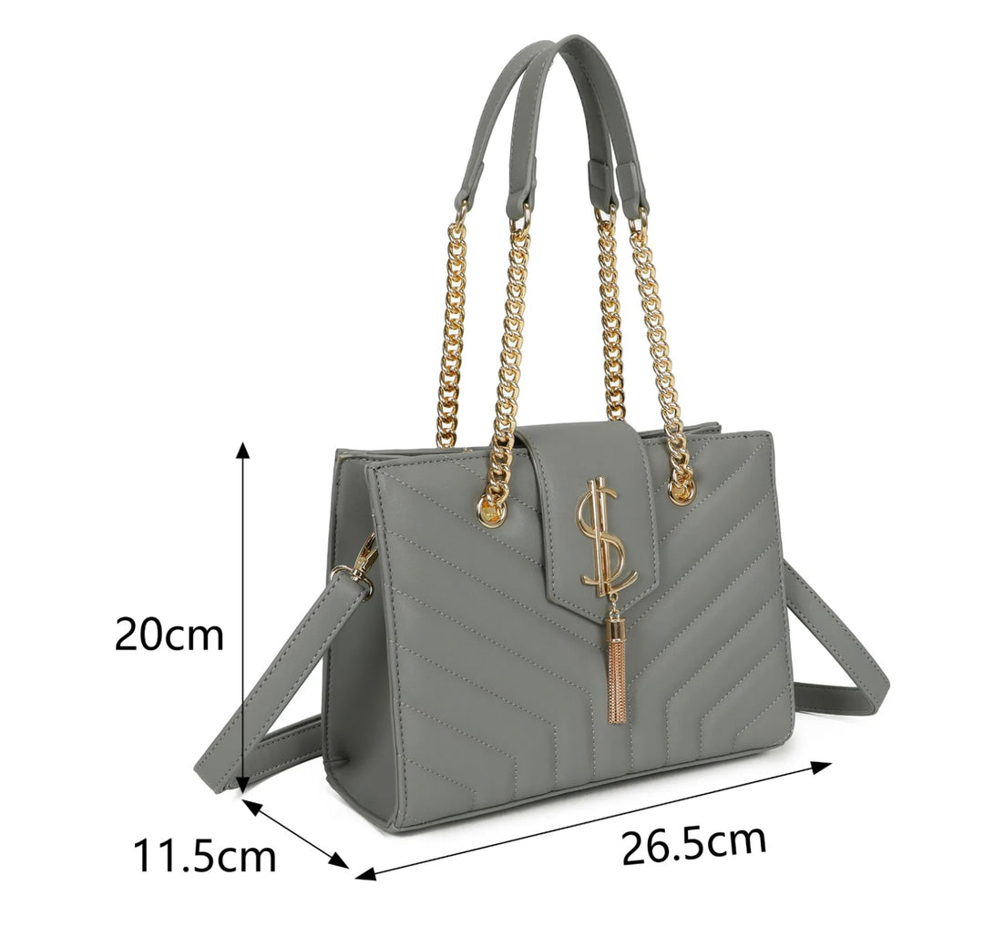 A grey quilted shoulder bag with gold chain detail and a long adjustable removable crossbody strap 