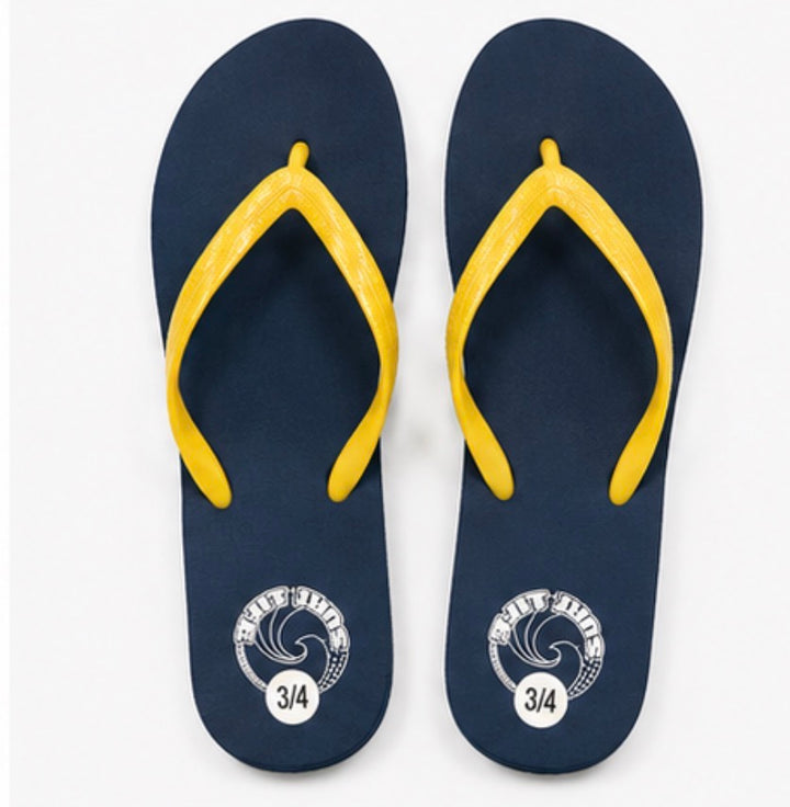 Navy blue flip flops with bright yellow straps 