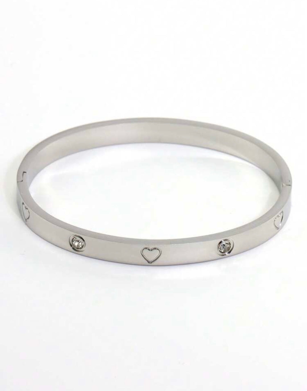 Silver three-piece stainless steel love bangle bracelet set with heart charms and crystal detailing.