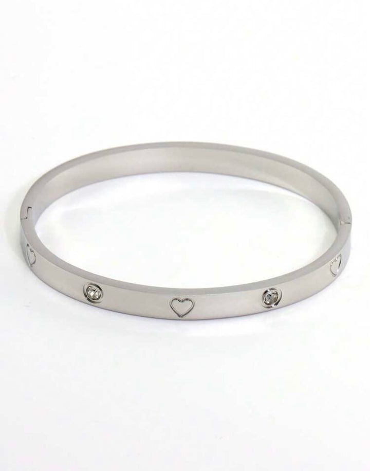 Silver three-piece stainless steel love bangle bracelet set with heart charms and crystal detailing.