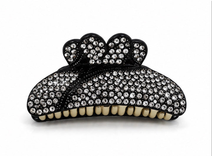 Black bow-shaped hair claw clip decorated with sparkling clear diamanté crystals