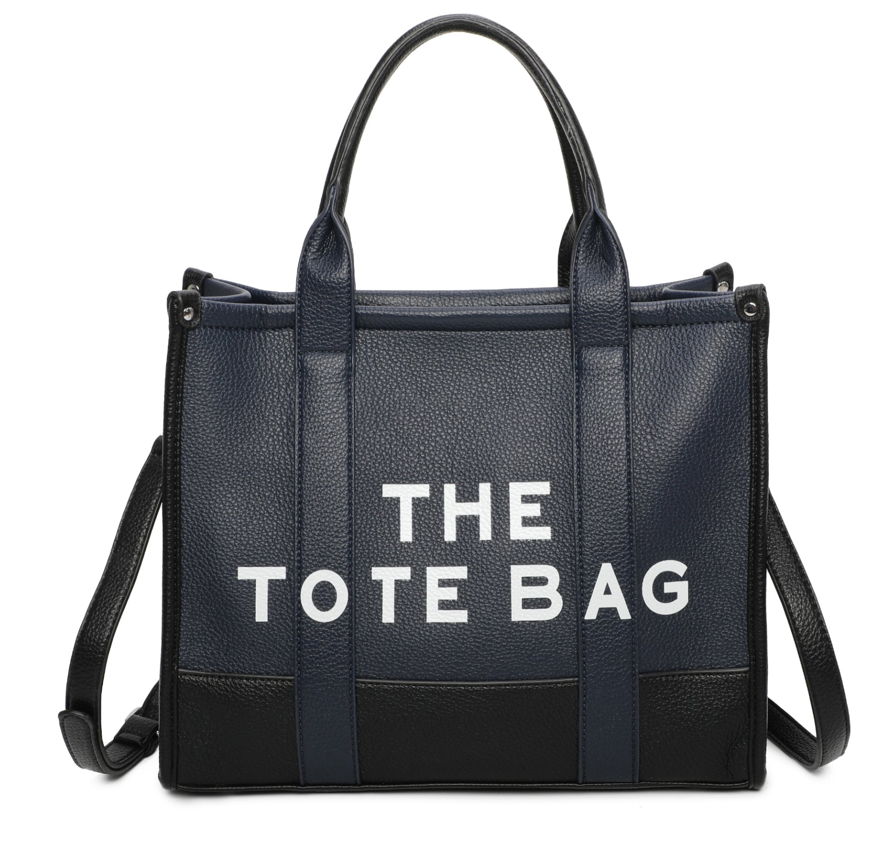 Two tone colour tote bag in navy. Black at the bottom of the bag, white writing stating “the tote bags” displaying a long strap to crossbody the bag.