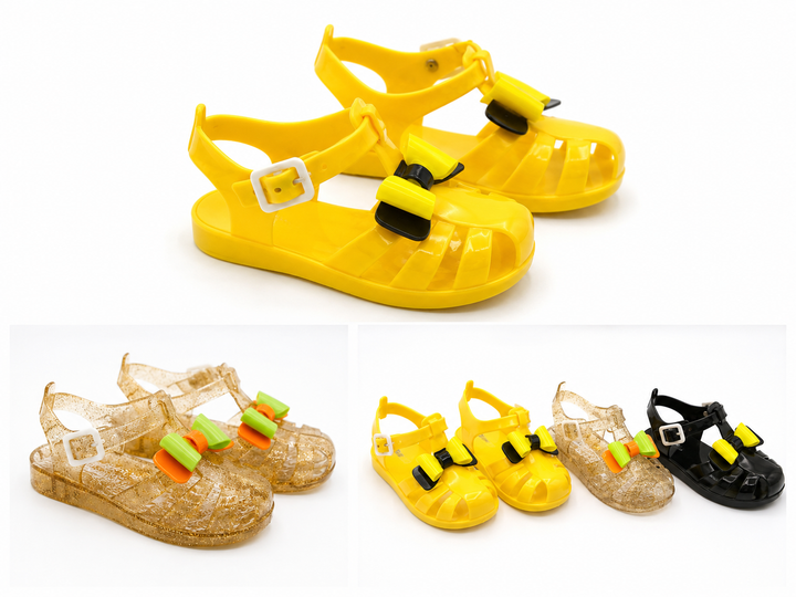 Girls colourful jelly sandals collection featuring yellow, black and glitter gold styles with decorative bows