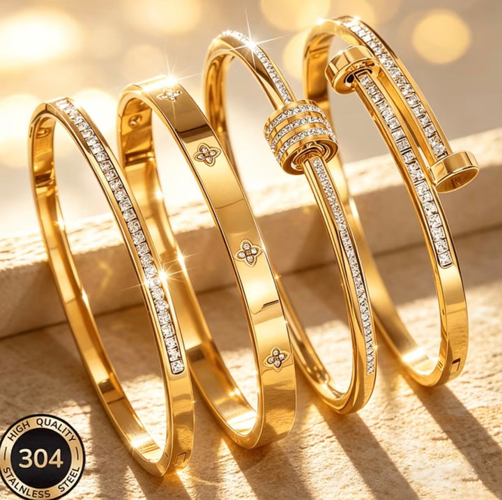 Luxury gold-tone stainless steel bangle bracelet collection with crystal detailing