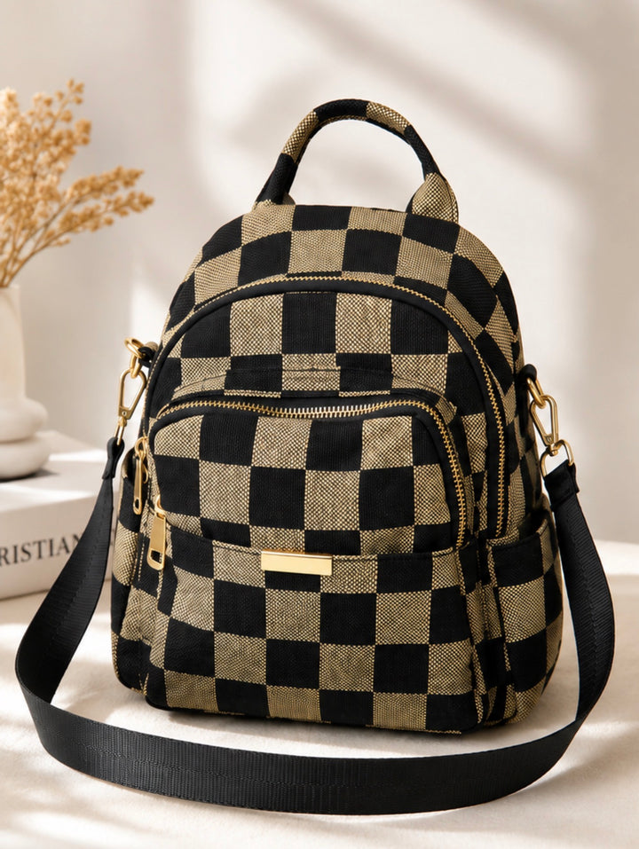 Black and tan checkerboard convertible backpack with adjustable straps and detachable crossbody shoulder strap.