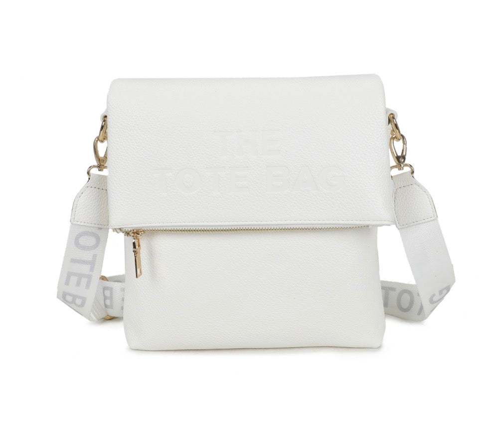 White crossbody bag with a strap featuring text 