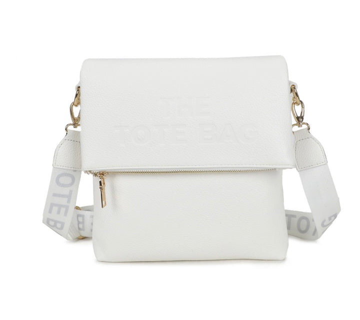 White crossbody bag with a strap featuring text 