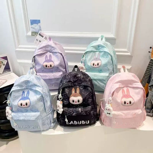 Collection of colorful backpacks with cartoon character design on a white surface.