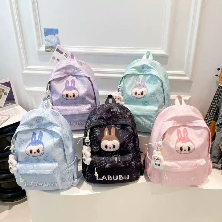 Collection of colorful backpacks with cartoon character design on a white surface.