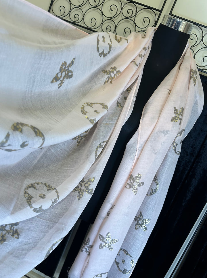 Thin lightweight scarf with flower print design, ideal for spring and summer wear.