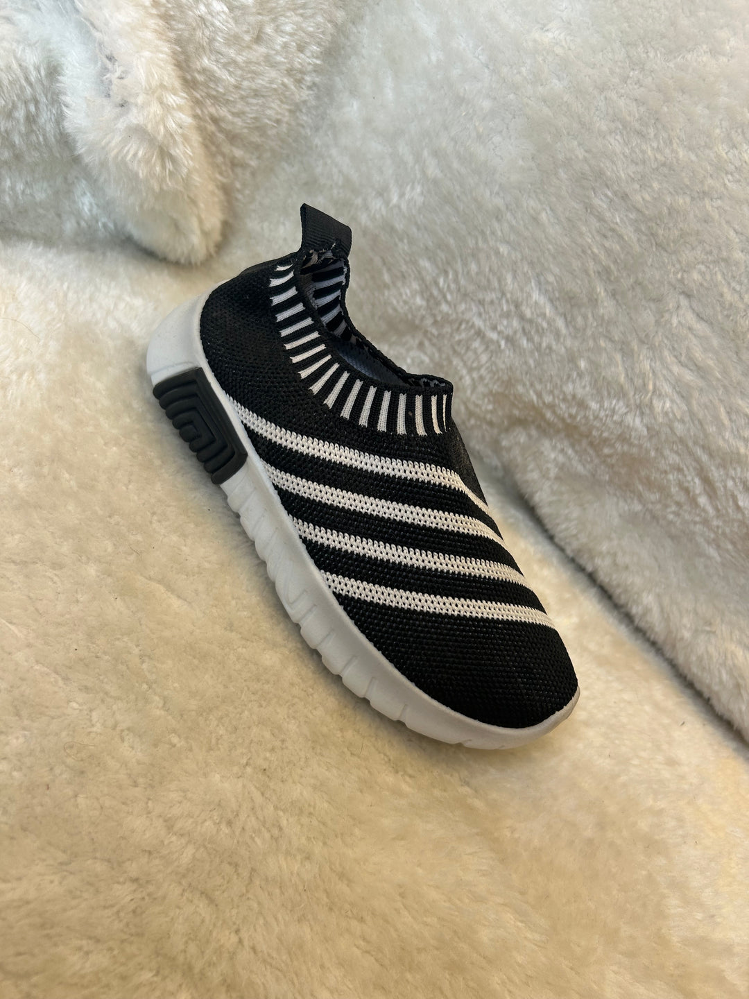 Children’s black &amp; white slip on trainers with white soles 