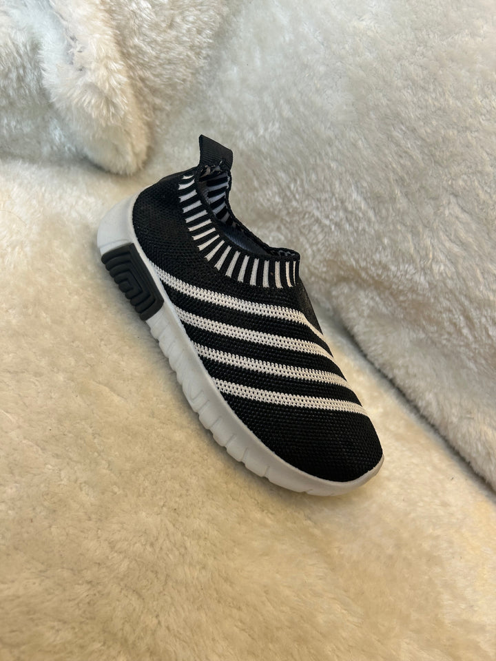 Children’s black &amp; white slip on trainers with white soles 