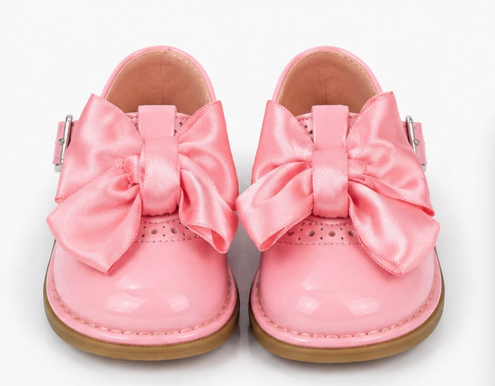 Pink baby girls formal shoes with elegant satin bow accents 