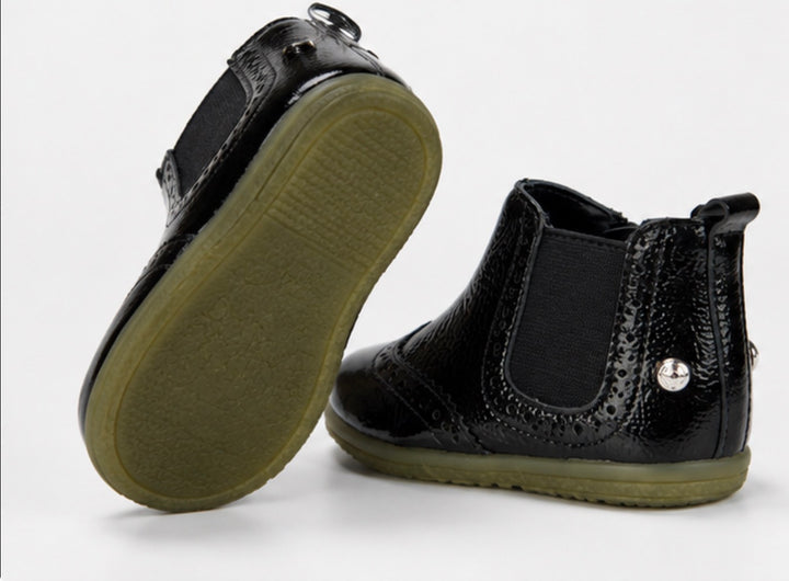 Children’s black patent ankle boots with textured finish, zip fastening and chunky sole