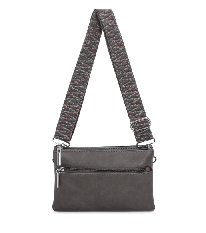 multi pocket crossbody bag with patterned adjustable shoulder strap and silver hardware.