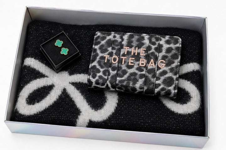 Luxury gift bundle collection featuring four coordinated sets with soft patterned scarves, matching purses, wallets and elegant earrings, beautifully presented in gift boxes.