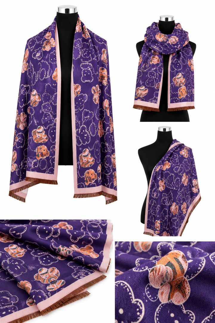 Teddy print oversized fringed scarf available in teal blue with cream trim and purple with pink trim.