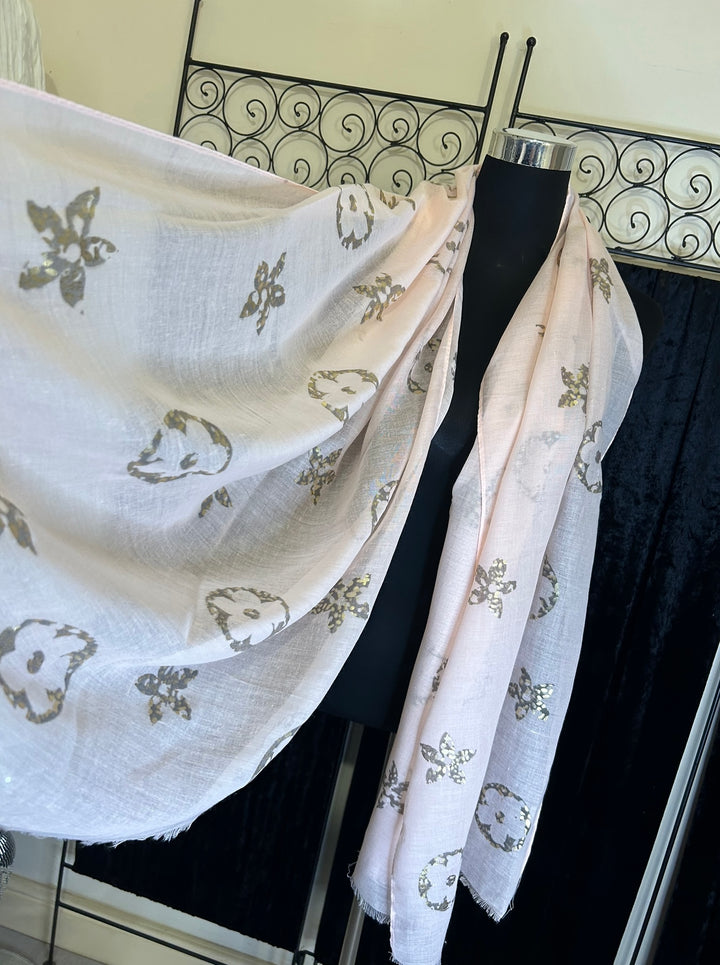Thin lightweight scarf with flower print design, ideal for spring and summer wear.