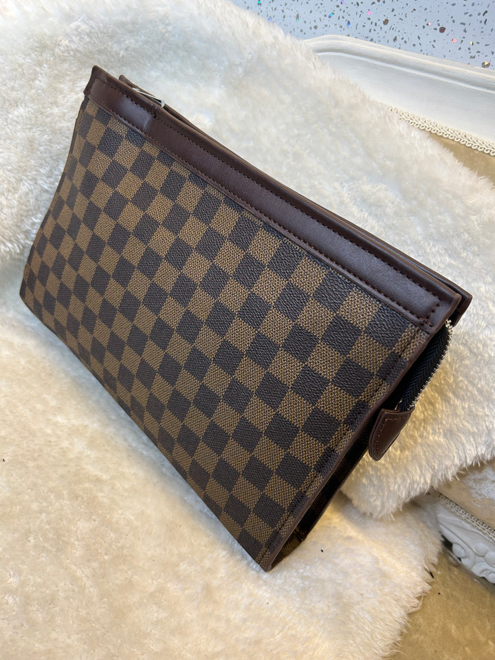 Checkered wallet clutch bag with a brown and black pattern 