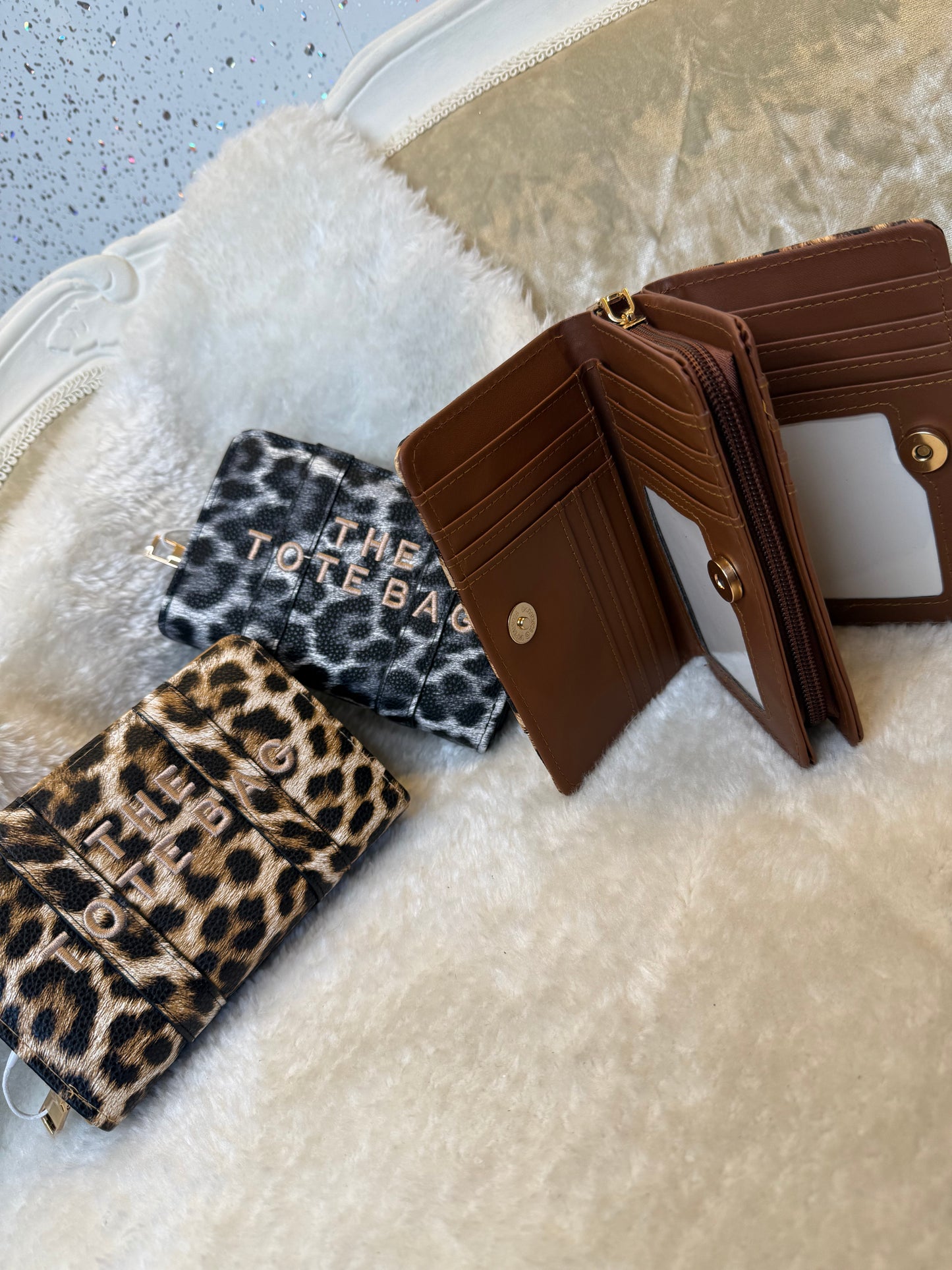 Leopard animal print card holders purses with embossed ‘The Tote Bag’ lettering and gold zip detail