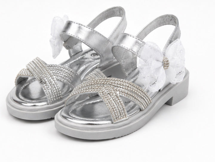 Silver girls’ sandals with sparkling diamanté crossover straps, oversized glitter mesh bow detail 